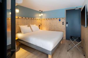 Letto o letti in una camera di Best Western Bourgoin Jallieu