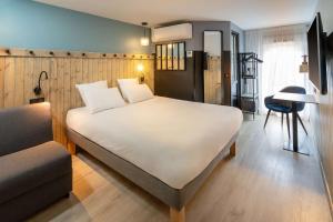 Letto o letti in una camera di Best Western Bourgoin Jallieu
