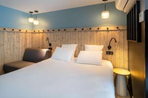 Letto o letti in una camera di Best Western Bourgoin Jallieu