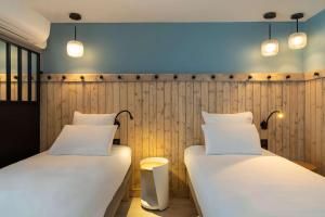 Letto o letti in una camera di Best Western Bourgoin Jallieu