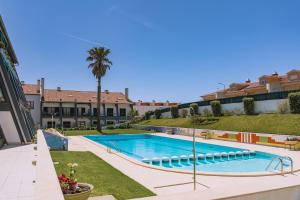 a swimming pool in the middle of a building at Surf GuestHouse - 7min walk to the beach in Pataias