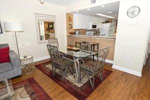 a dining room and kitchen with a table and chairs at SeaCrest 514 condo in Fort Walton Beach