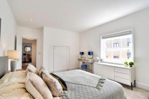 Кровать или кровати в номере Stunning apartment in the Heart of Chelmsford