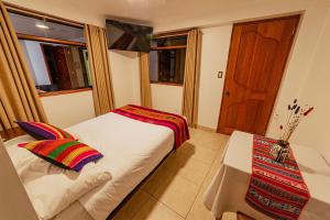 En eller flere senge i et værelse på Sacred Inka House