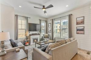 a living room with a couch and a fireplace at Park City Cozy Cottage in Heber City