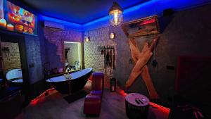 a bathroom with a bath tub and a claw foot bath tub at Magik Love Apartament in Piła