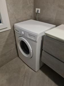 a washer and dryer in a small bathroom at VENEZIA Beach in Chioggia
