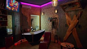 a bathroom with a bath tub in a room at Magik Love Apartament in Piła
