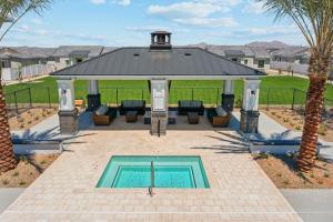 a swimming pool with a gazebo and a swimming poolvisor at Luminous Sunrise Home in Casa Grande with Pool,BBQ in Casa Grande