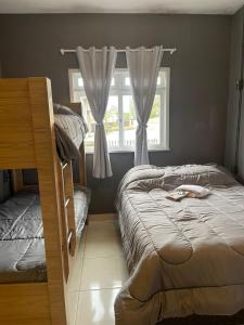 Кровать или кровати в номере Hostel Portal Pomerode
