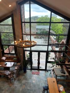 a large room with a large window with a view at SeeU Coffee and B&B in Xihu