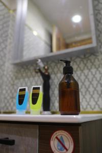 a bottle of soap on a counter in a kitchen at Three pyramids view INN in Cairo