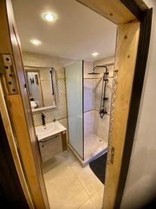 a bathroom with a shower and a sink at Three pyramids view INN in Cairo