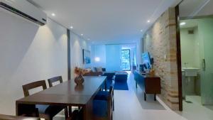 a living room with a table and a couch at Luxurious stay at modern apartment (Equipetrol) in Santa Cruz de la Sierra
