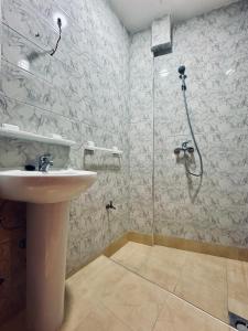 a bathroom with a shower and a sink at Aourir soul hostel in Aourir +21 photos