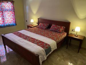 Ένα ή περισσότερα κρεβάτια σε δωμάτιο στο Mango Guesthouse