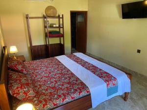 Ένα ή περισσότερα κρεβάτια σε δωμάτιο στο Mango Guesthouse