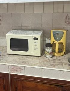 a microwave sitting on top of a counter at Appartement Casablanca in Casablanca