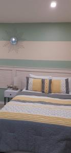 a bedroom with a large bed with pillows at Riverside Bed and Breakfast in San Juan +17 photos