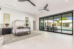 an open living room with a bed and a pool at Old Town Scottsdale Luxury Villa - Heated Pool, Spa, Rooftop Deck, Sauna, Speakeasy in Scottsdale