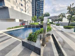 a swimming pool in the middle of a building at Setia Sky 88 by Cactus Homestay THM in Johor Bahru