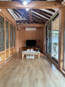 a living room with a table in the middle at Stay Moon Charm in Gyeongju