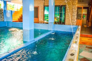 a pool in a house with a swimming pool at Casa de Madera The Wooden House Staycation Transient and Private Resort in Cabuyao