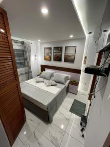 Postel nebo postele na pokoji v ubytování Residence Therese La Grâce