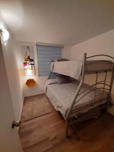 Giường trong phòng chung tại Departamento La Serena Full Equipado