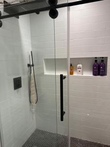 a shower with a glass door in a bathroom at Condo in Dana Point in Dana Point