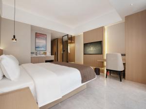 Letto o letti in una camera di JD POLMAN Hotel