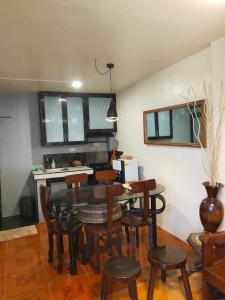 a dining room with a table and chairs at Z and J Transient House in Butuan