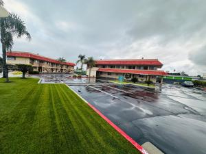 an empty parking lot in front of a building at Americas Best Value Inn Calimesa in Calimesa