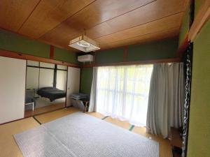 Llit o llits en una habitació de 田辺ハウス