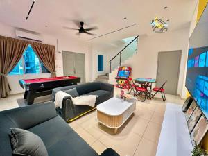 a living room with a couch and a pool table at BukitKatil16pax-snooker｜arcade in Malacca