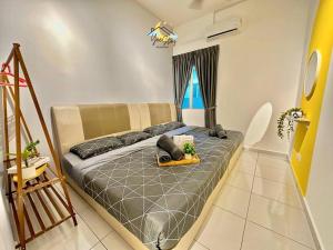 a bedroom with a bed and a window at BukitKatil16pax-snooker｜arcade in Malacca