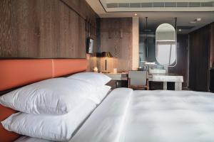 Postel nebo postele na pokoji v ubytování Sheraton Taitung Hotel