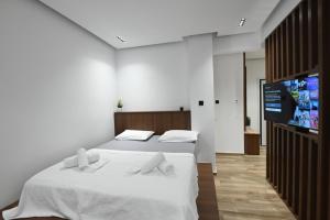 Säng eller sängar i ett rum på Thessaloniki Amazing Apartment