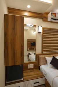 Postel nebo postele na pokoji v ubytování M!steria Inn Wayanad