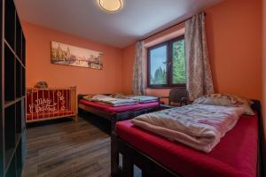 Postel nebo postele na pokoji v ubytování White Hawk - Vila Sokolík