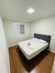 Cama o camas de una habitación en Ap Luxuoso e Estiloso