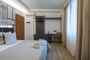 Postel nebo postele na pokoji v ubytování Hotel Mia Cara & Spa