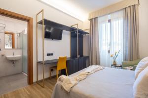 Postel nebo postele na pokoji v ubytování Hotel Mia Cara & Spa