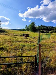 a fence in the middle of a field at Jílová tvrz in Rožmberk nad Vltavou