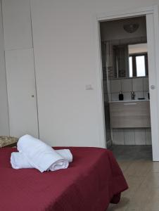 Säng eller sängar i ett rum på CAPORELLA Dimora della via Appia