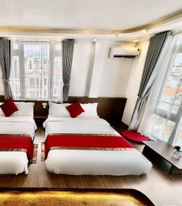 Postel nebo postele na pokoji v ubytování Le Tuan Minh Hotel