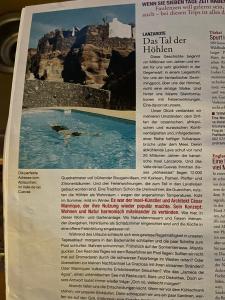 een krantenartikel met een foto van een zwembad bij Castillo Lanzarote Villa 1 - Sleep in a Volcanic Cave in Tías