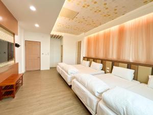 Postel nebo postele na pokoji v ubytování 綠島海灣會館Bay Resort