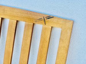 a wooden chair with a clock on top of it at Dragonfly Motor Lodge in Panguitch