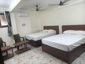 Voodi või voodid majutusasutuse Hotel Krishna toas